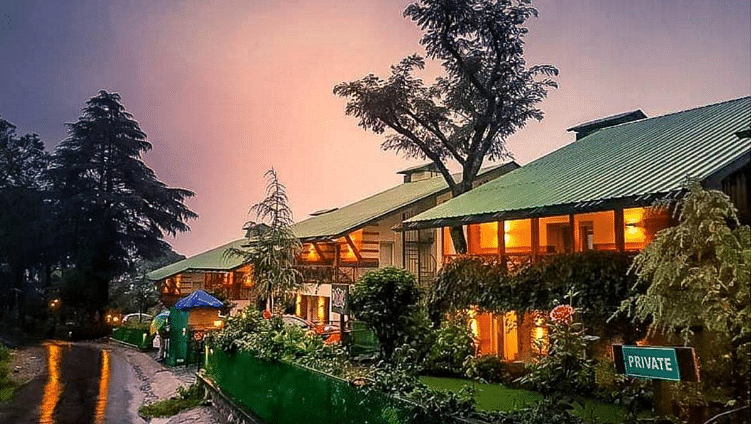 An enchanting exterior of our hotel decorated with aesthetic yellow lights and captured during sunset - Lamrin Norwood Green, Palampur2