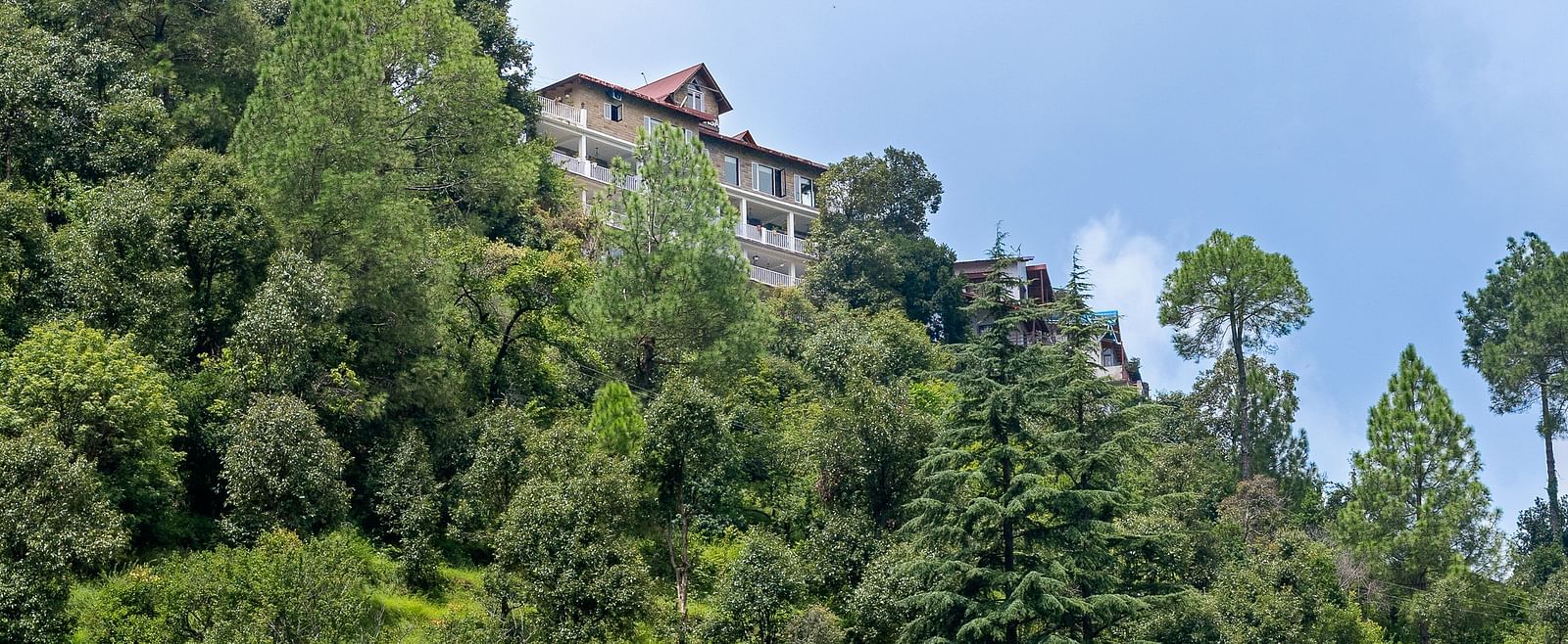 Scenic view of BluSalzz Collection - Suvaasa Resort, Ramgarh nestled on a lush hillside