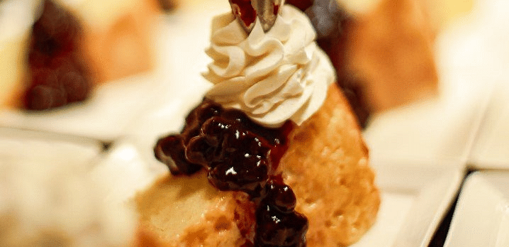 Close-up of small pastries or baked goods arranged on a serving dish.