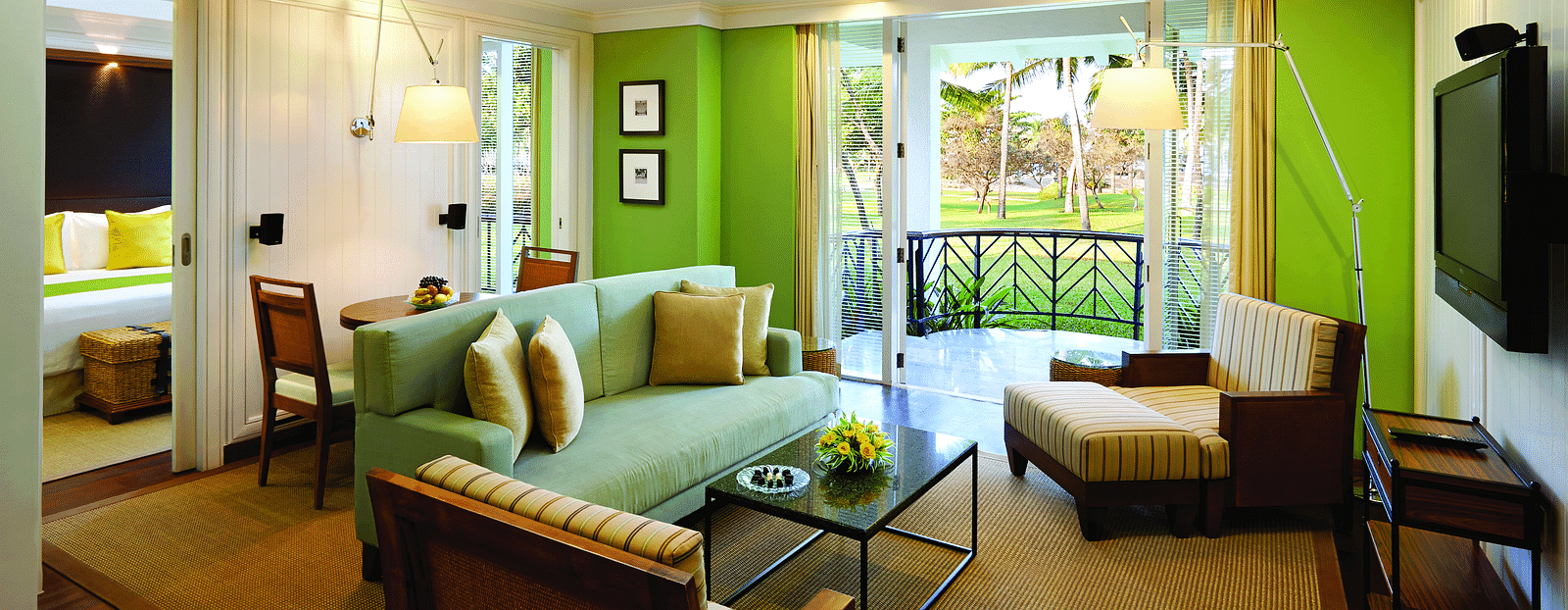 overview of the living room with sofas and table inside Presidential Villa - Caravela Beach Resort Goa