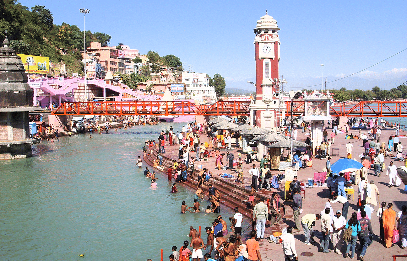 a crowd of people taking dips in a river turn by turn