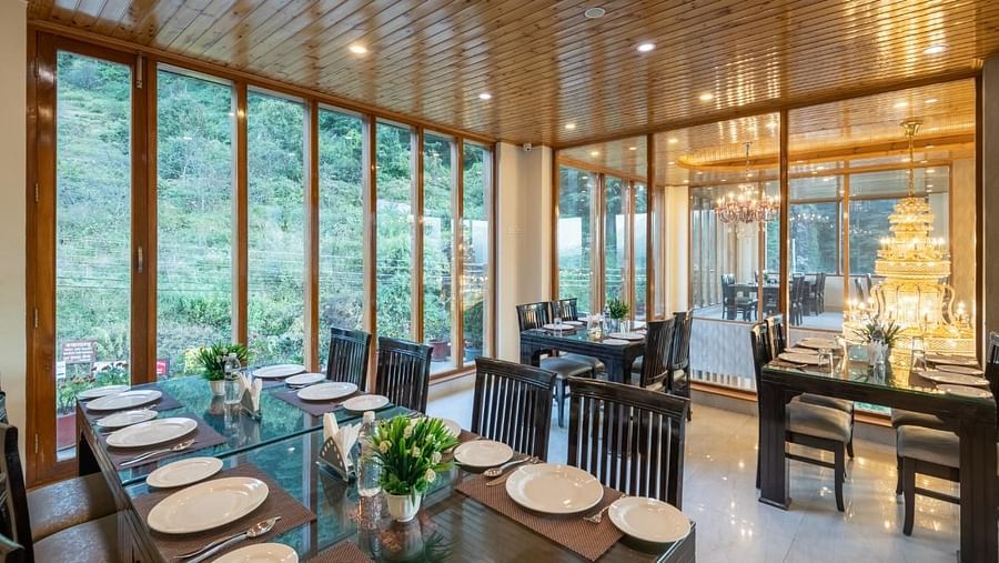 Image of a seating arrangements with tables and chairs, likely designed for both casual and formal dining.