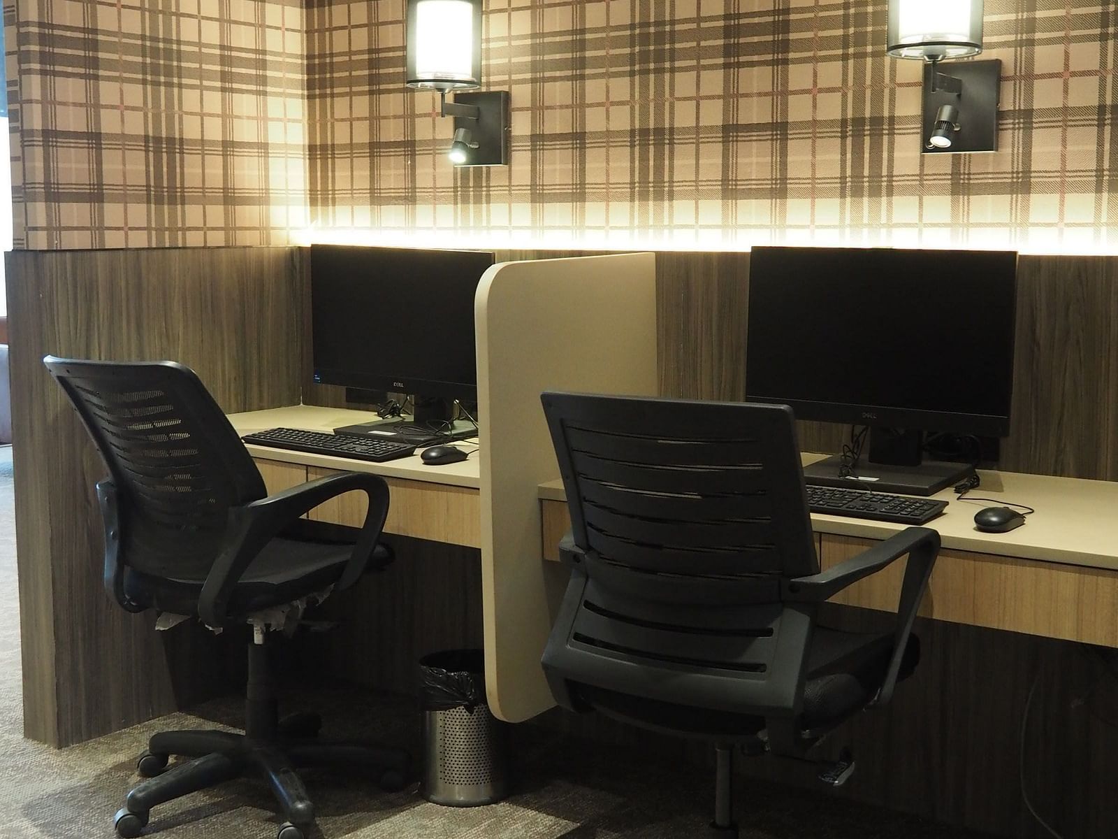 A small office space with two desks, chairs and a computer placed on the table - Club Charholi, Pune 