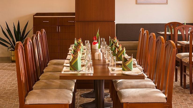 An overview of the seating arrangement inside the restaurant - Abad Copper Castle, Munnar