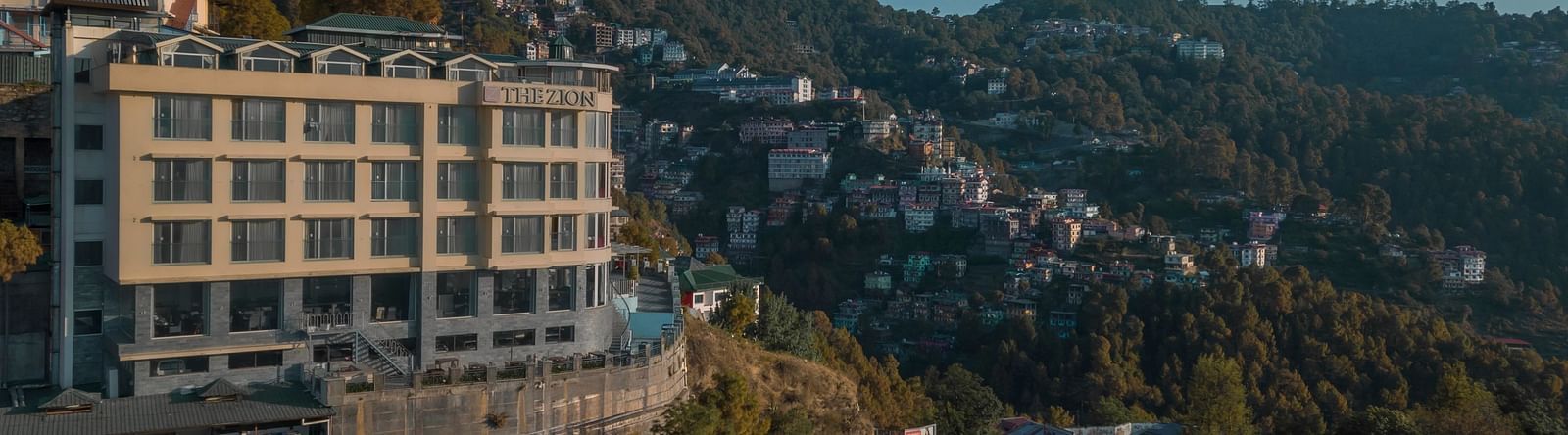 facade image of the zion, shimla amidst the mountains