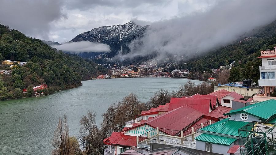 A top view of a beautiful village by a lake 