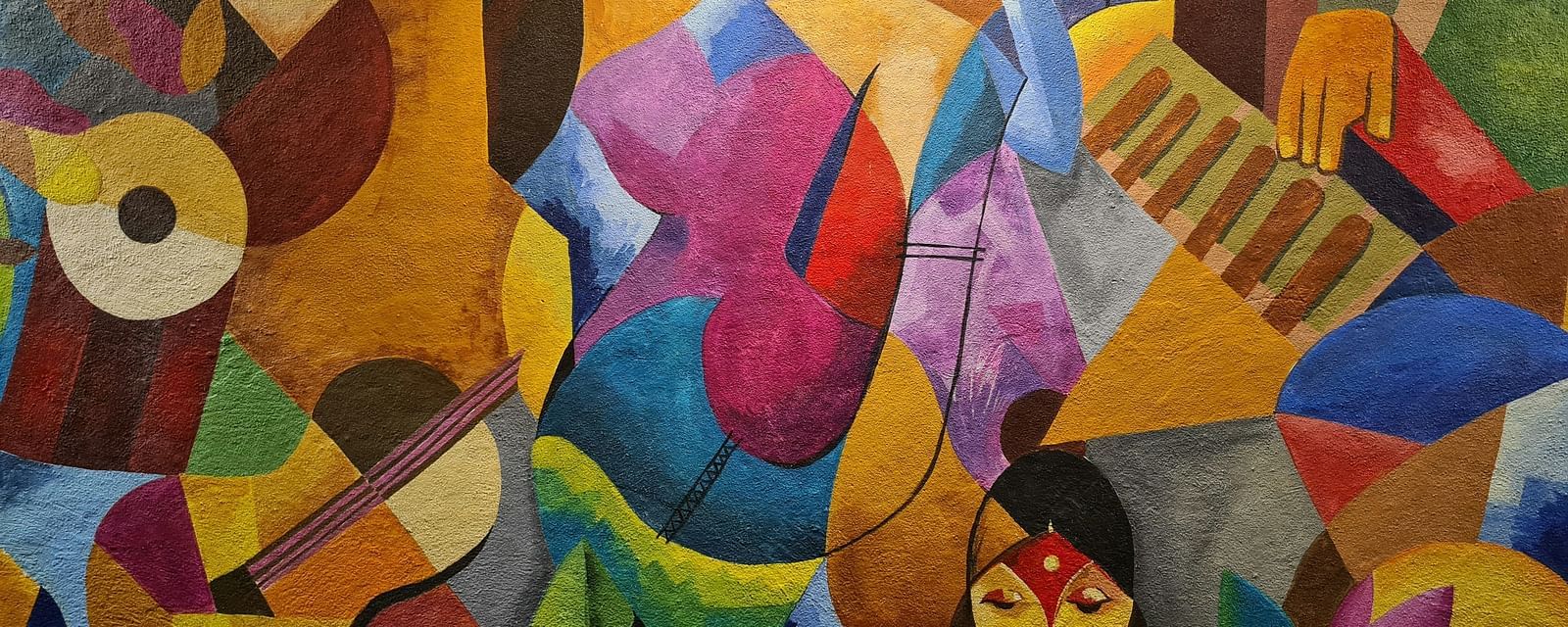 An overview of an abstract painting with a spotlight on it.