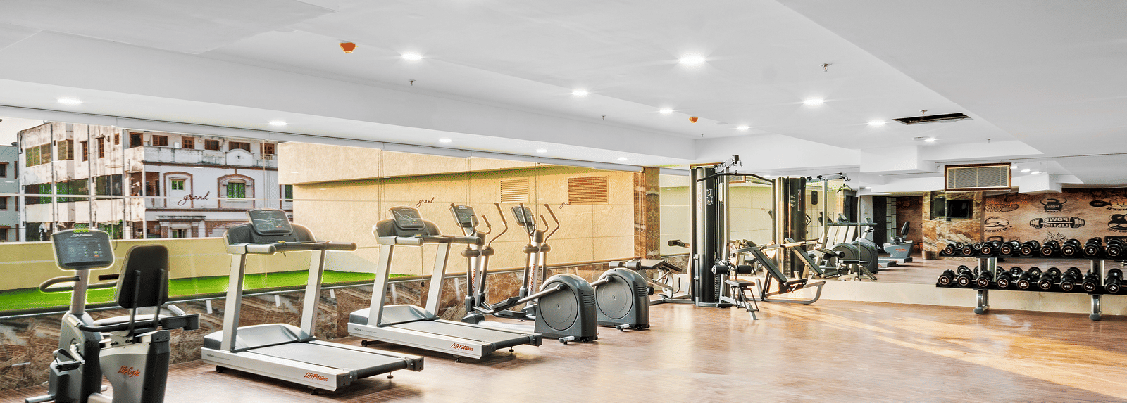 The fitness centre with treading mills placed next to each other at Grand Vijayawada by GRT Hotels.