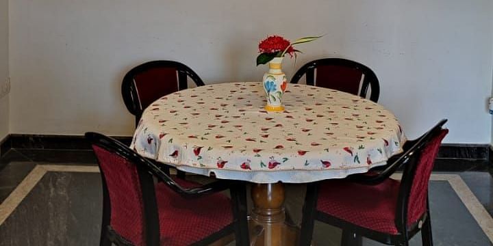 Image of a round table with four chairs around it at Villa Serenity Le Sejour Pondicherry.