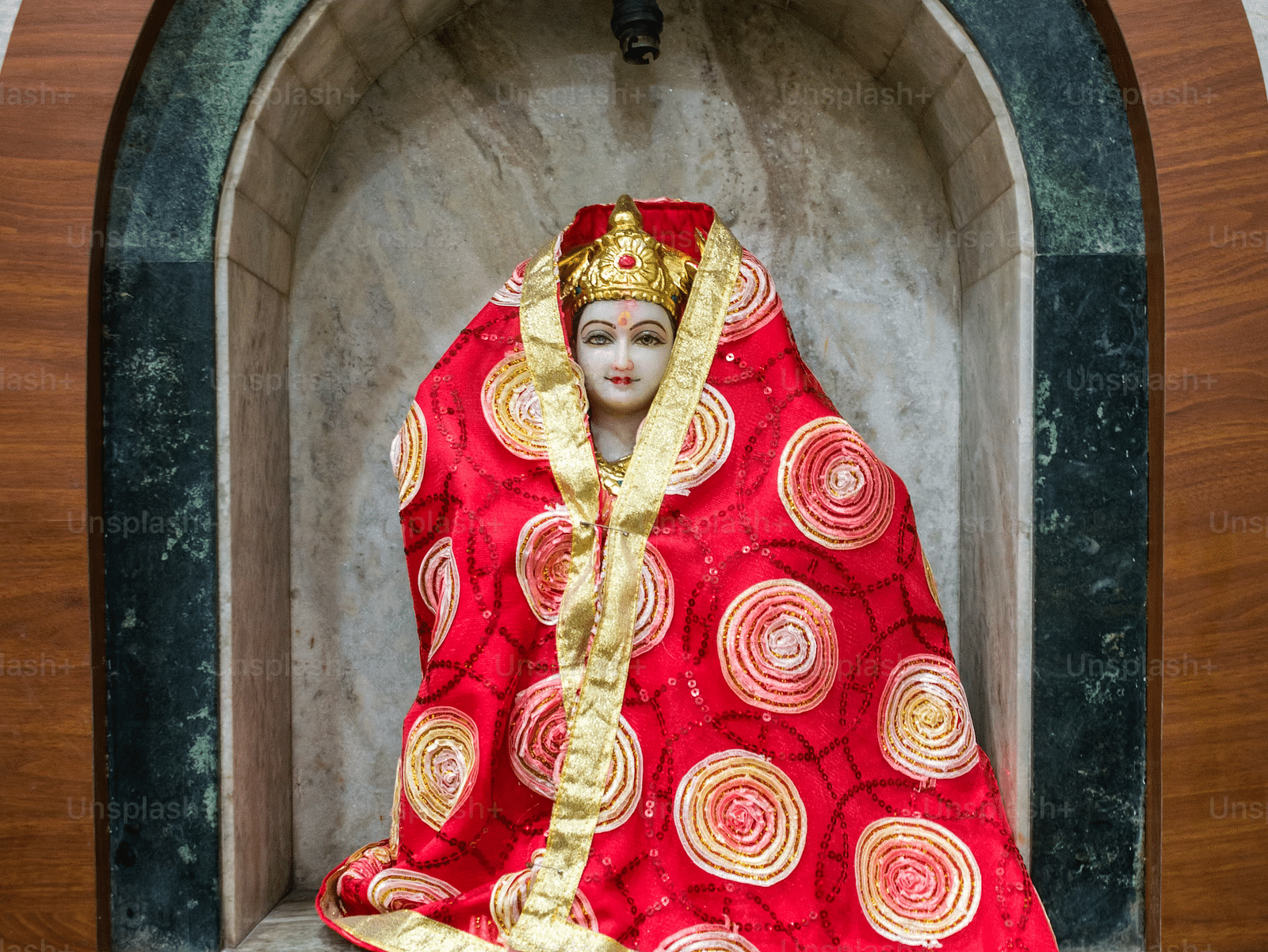 Image of Sita covered in a shawl
