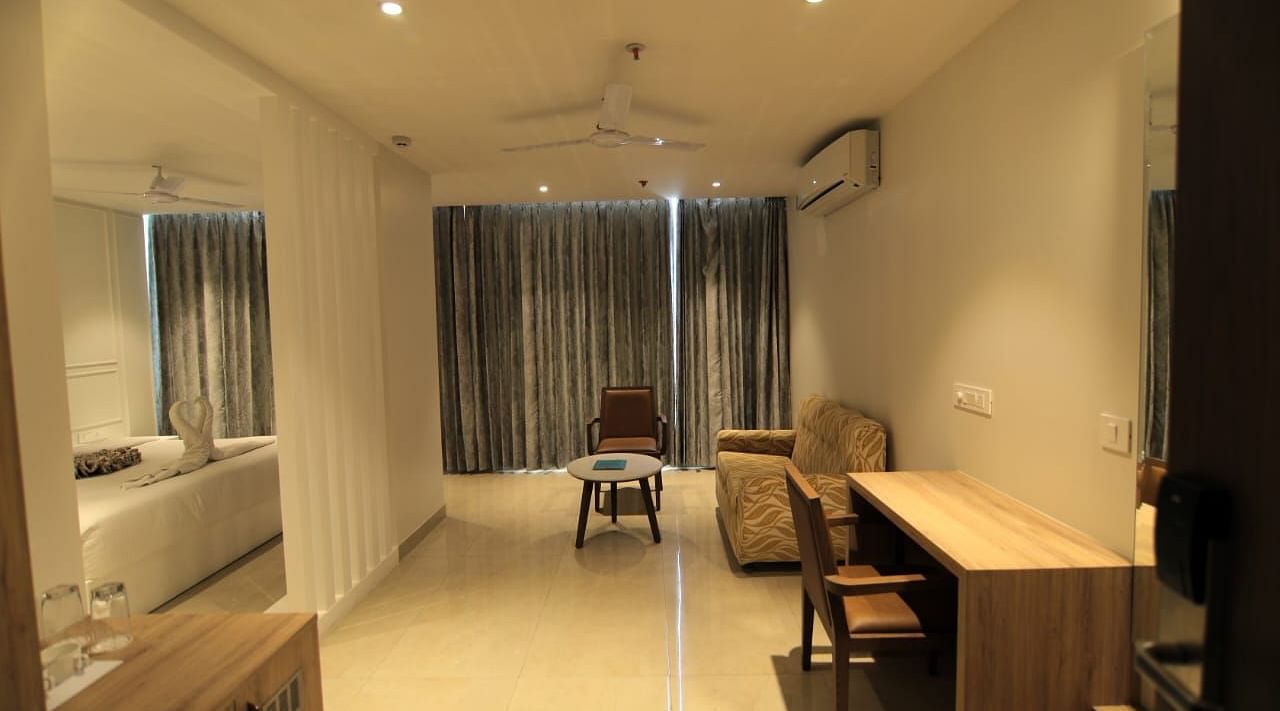 Suite at Hotel Mumbai House Express, Udaipur with a bedroom and a separate living room