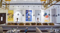 The buffet counter inside tulipe restaurant with staff behind at Tulip Inn, Shravasti