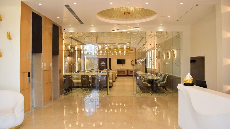 Entrace to tulipe restaurant with floor to celing glass windows at Tulip Inn, Shravasti