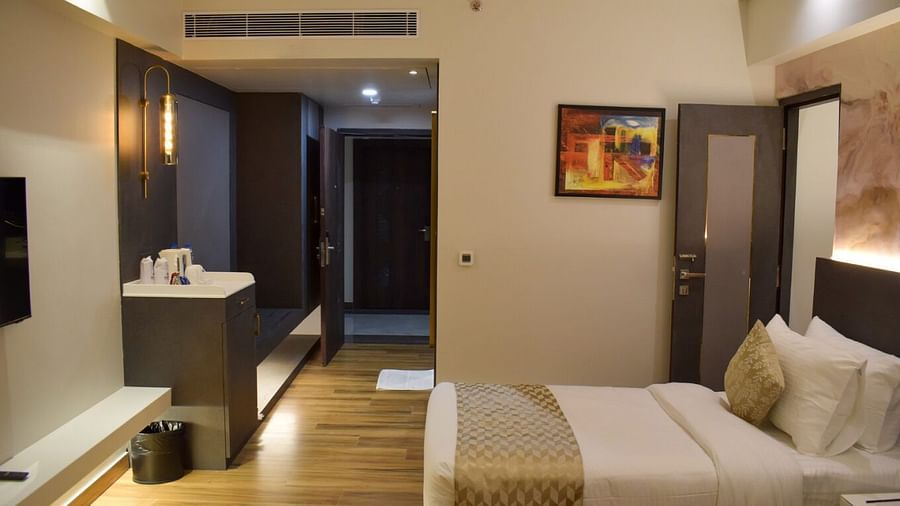 Entrance to the room with a twin bed inside executive room at Tulip Inn, Shravasti