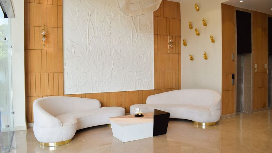 Modern sofa with a coffee table in front of it at Tulip Inn, Shravasti
