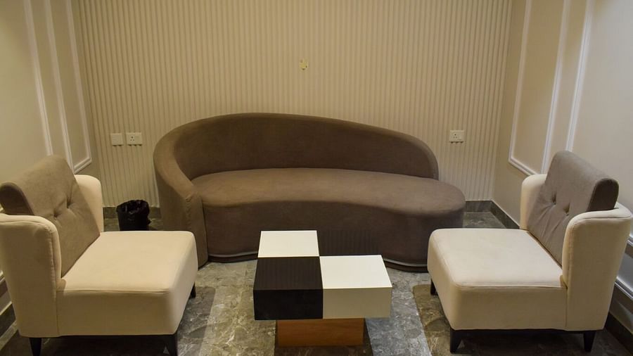 Overview of the living area with sofas and a coffee table inside suite at Tulip Inn, Shravasti