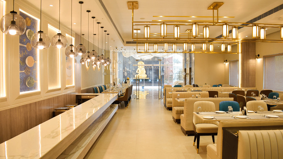 Seating arrangement inside tulipe restaurant at Tulip Inn, Shravasti
