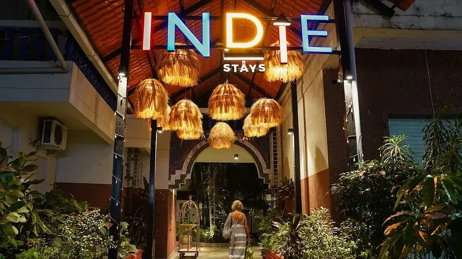 Entrance with a board sign to Indie Stays Resort, Goa