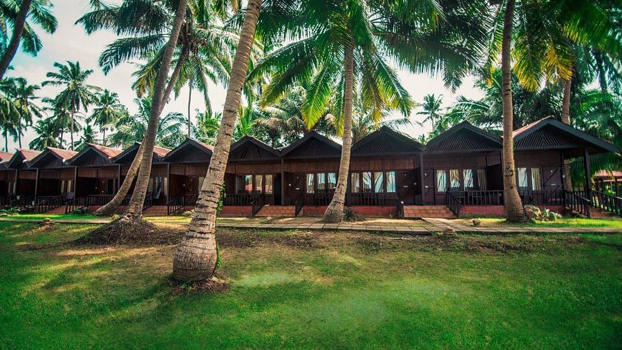 Huts located in a lush green setting in Port Blair Resort 