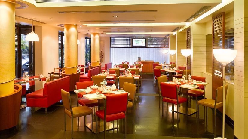 interior view of dining section at Aromas Coffee Shop - Coffee Shop in Kolkata - Kenilworth Hotel