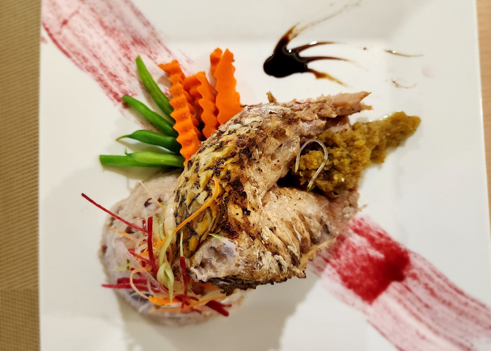 A lobster dish served with a side of sauce - Hotel 39, Jamaica