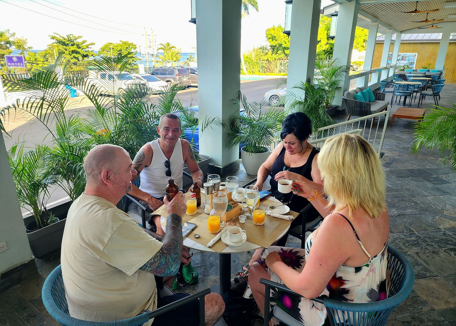 Guests enjoying an outdoor meal at a shaded dining area at Alexander Dining in montego bay, jamaica - Hotel 39, Jamaica