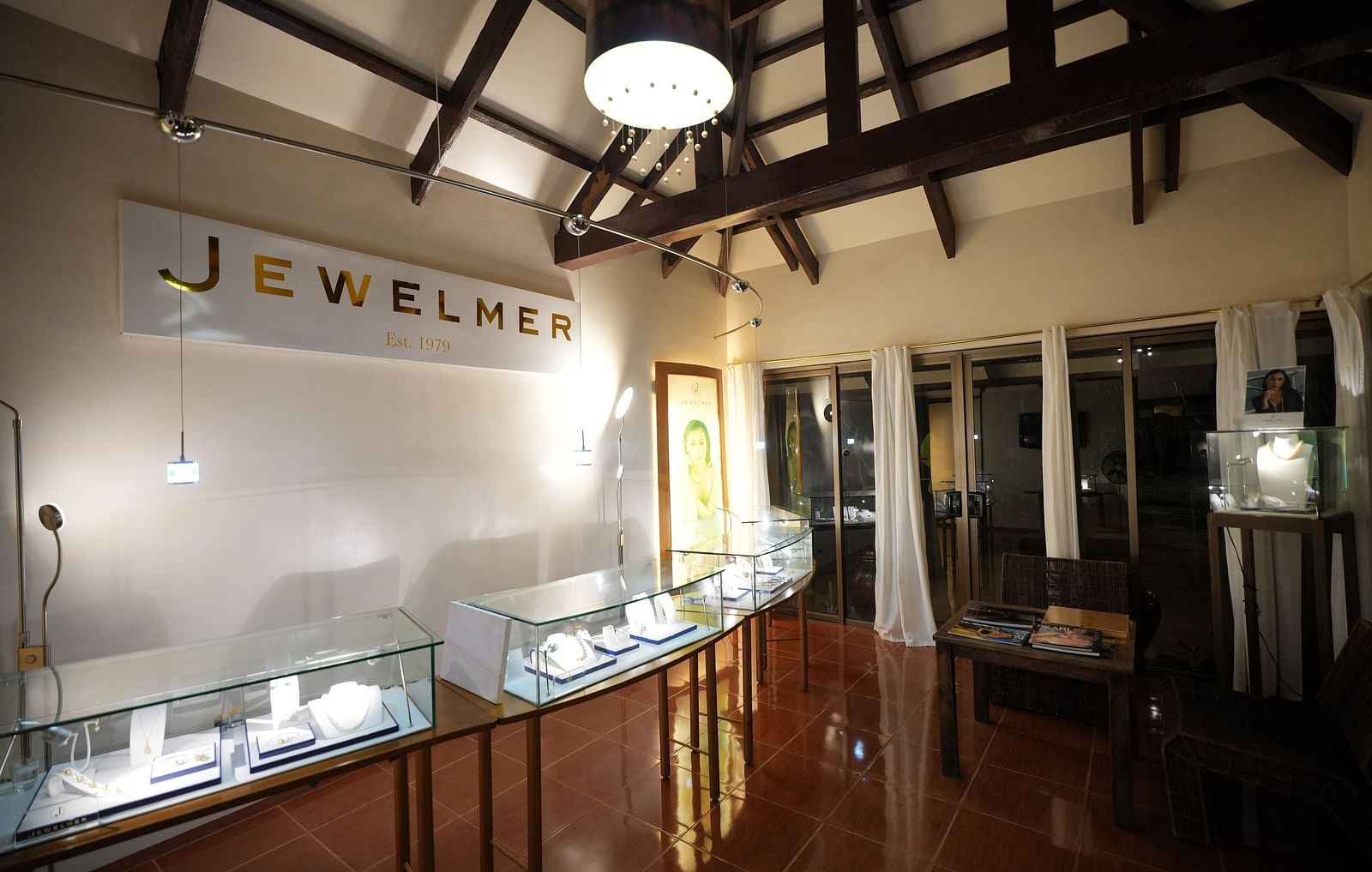 High-end jewelry store interior with elegant lighting and display counters.