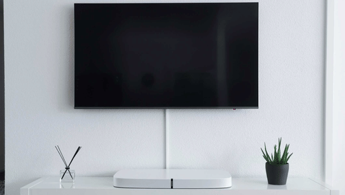 A TV placed on a white wall