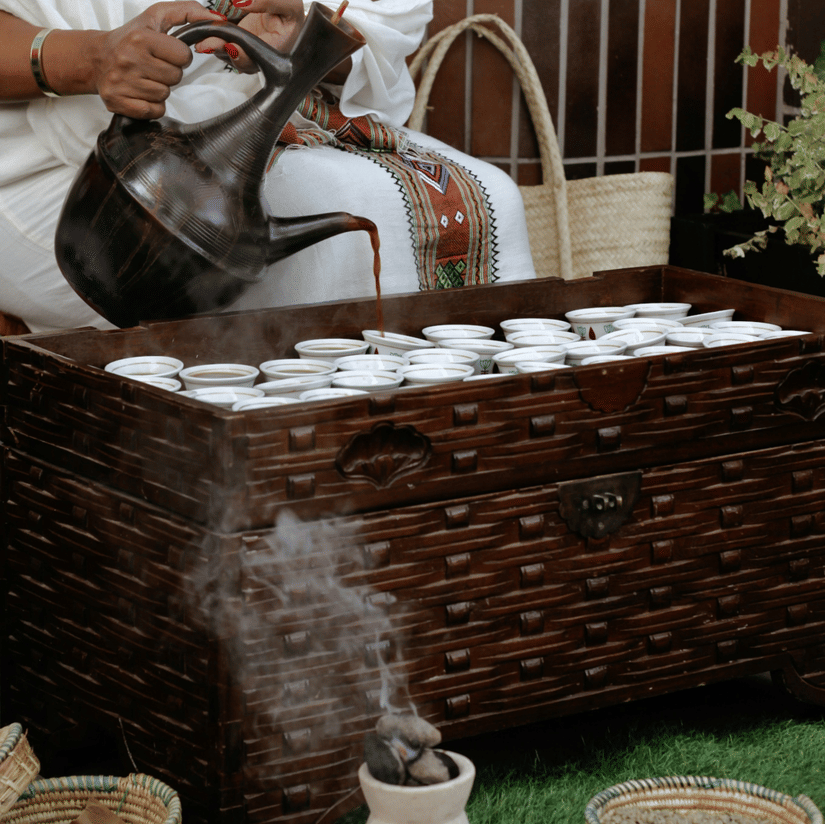 Ethiopian coffee being poured from a Jebena during the buna ceremony.