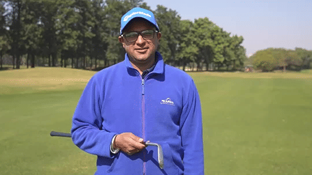 Anup Singh on a gold course during daytime - Karma Lakelands.