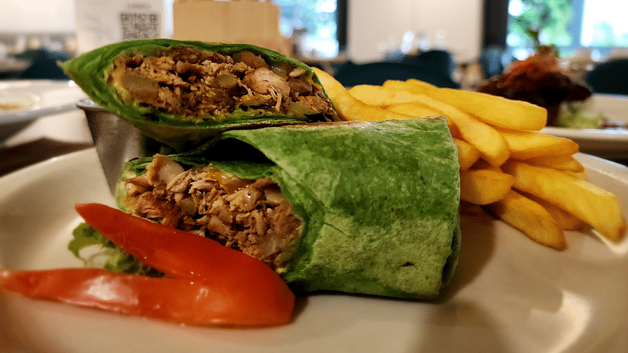 A wrap with fries and fresh veggies on the side - Hotel 39, Jamaica