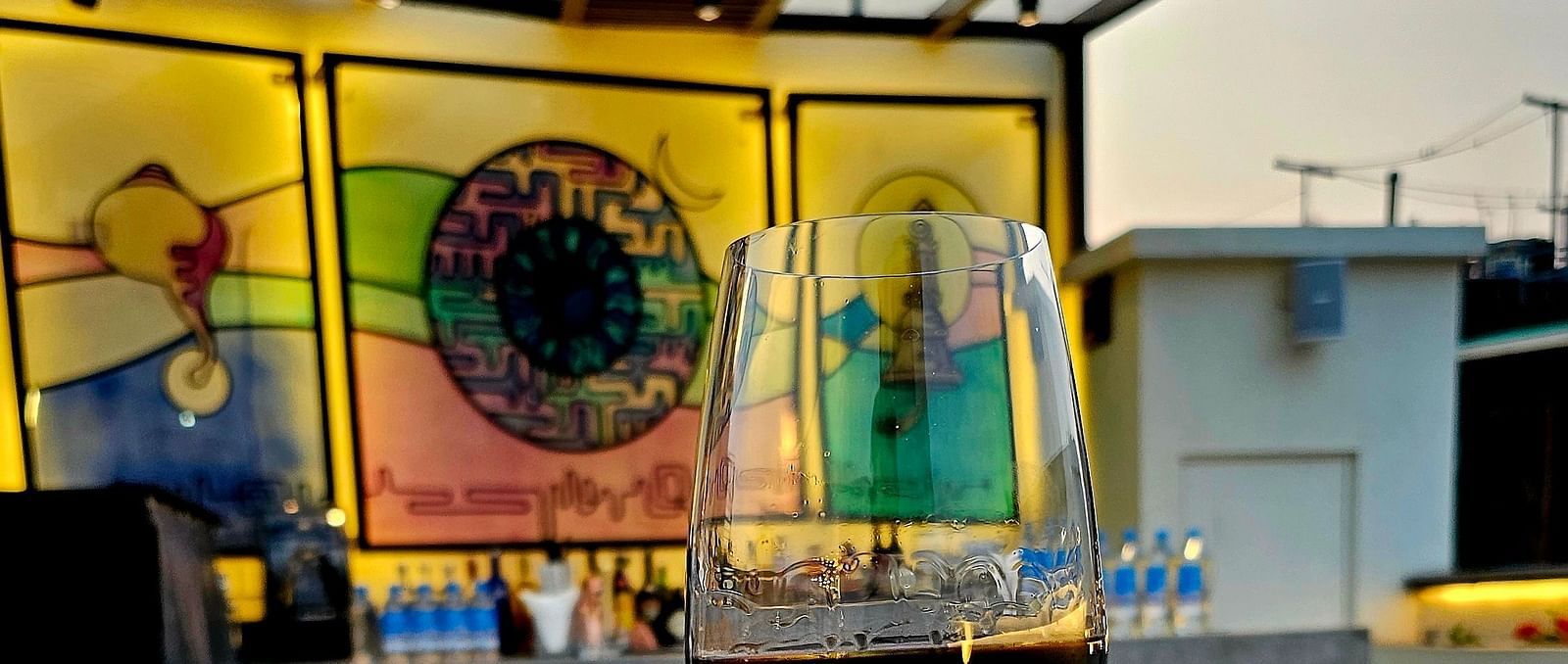 A rooftop restaurant with a wine glass