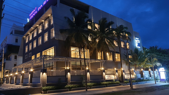 Hotel exterior in night sky with warm lighting around
