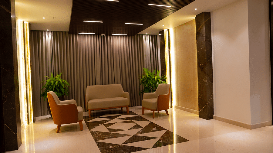 Three sofas kept in the corridor of Visthara - Urban Boutique Hotel, Bangalore