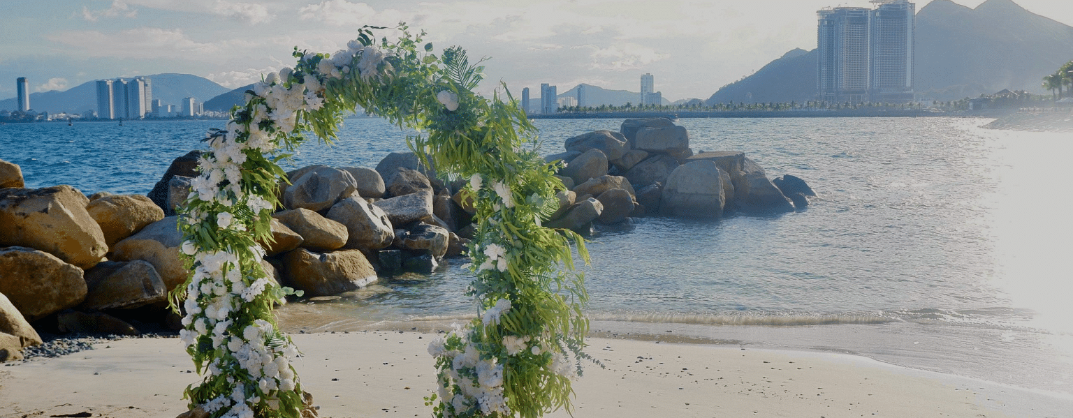 An image of a beach side decorated with flowers - Alibu Resorts Nha Trang