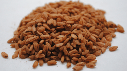 red rice kept in a bunch on a table