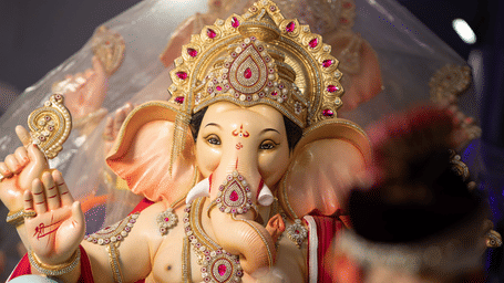 Stock illustration depicting a Ganesh idol during a religious celebration.