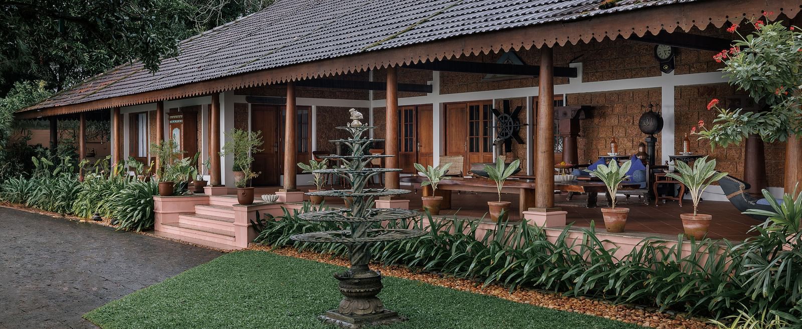 A facade of BluSalzz Villas - Muhamma Resort, Alleppey featuring the villas and greenery around it