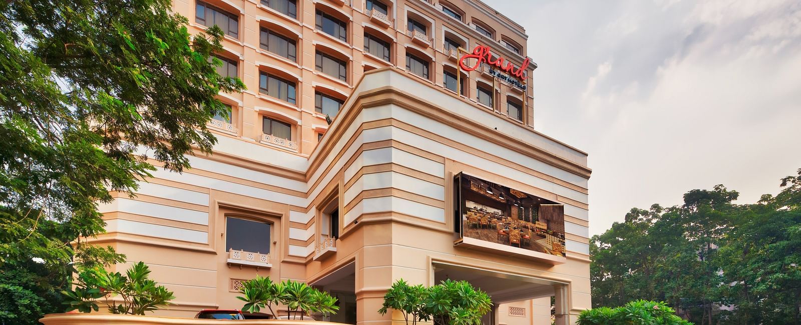 Facade of Grand Chennai By GRT Hotels during daytime.