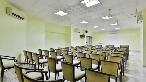 A conference hall with chairs facing the stage at VITS Select, Bharuch.