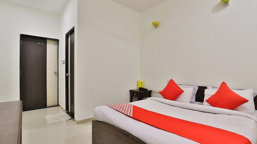 A room with a large bed at VITS Select, Bharuch.