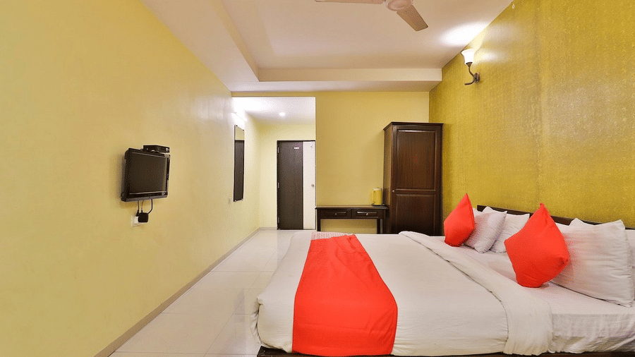 Suite room with a large bed facing the TV at VITS Select, Bharuch - one of the best rooms in Bharuch, Gujarat.
