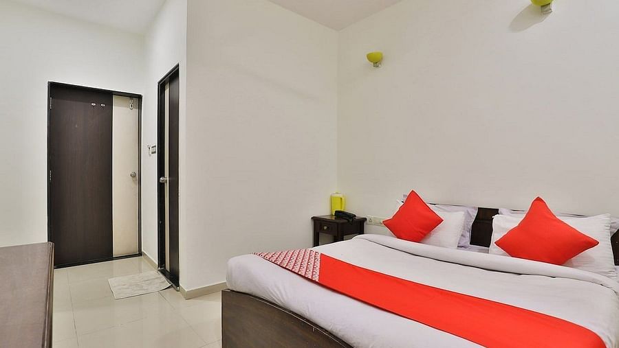 A room with a large bed at VITS Select, Bharuch.