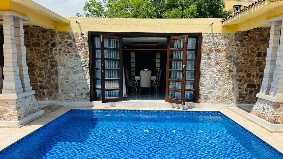 a swimming pool right in front of a room