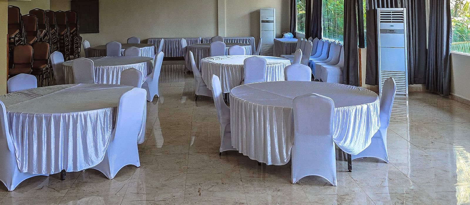 Spacious conference room with elegant round-table seating for meetings or functions at The Verda de Miranda Resort.