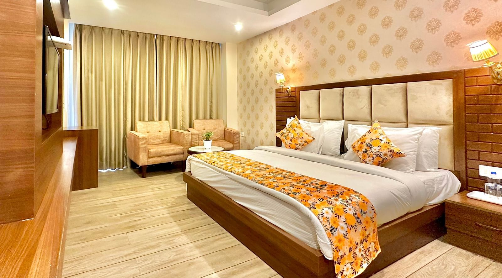 corner view image of the premium room with elegant interiors and warm lighting - ZENQ SIGNATURE INN, MCLEODGANJ