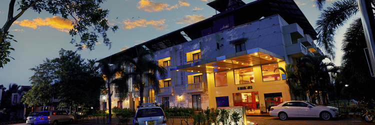 the exterior of the hotel, MGM Vailankanni Residency, during evening