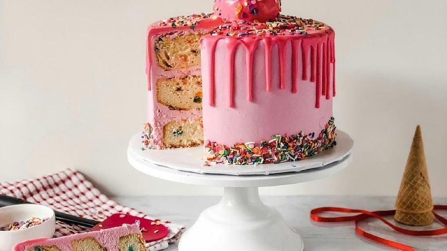 stawberry flavour Birthday cake decorated with ice cream cones
