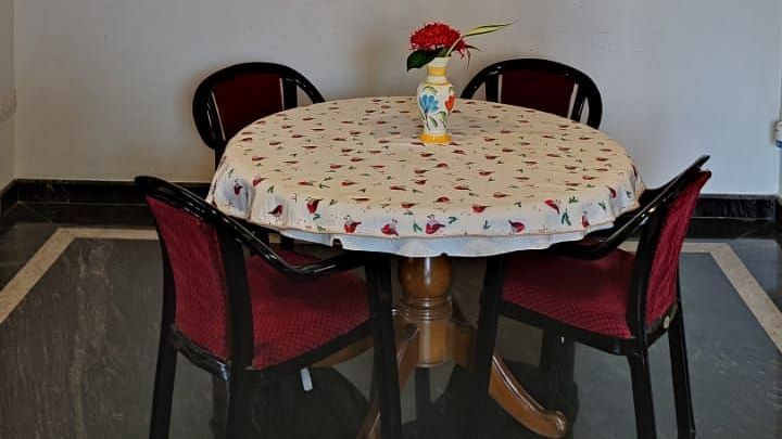 Image of a round table with four chairs around it at Villa Serenity Le Sejour Pondicherry.
