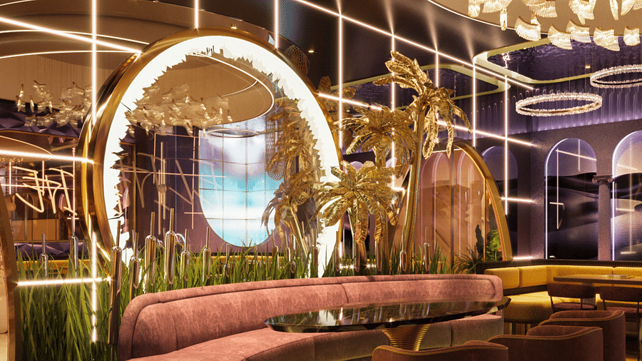 An image of a seating area with round table and sofas - Themis Barbecue House Ambala